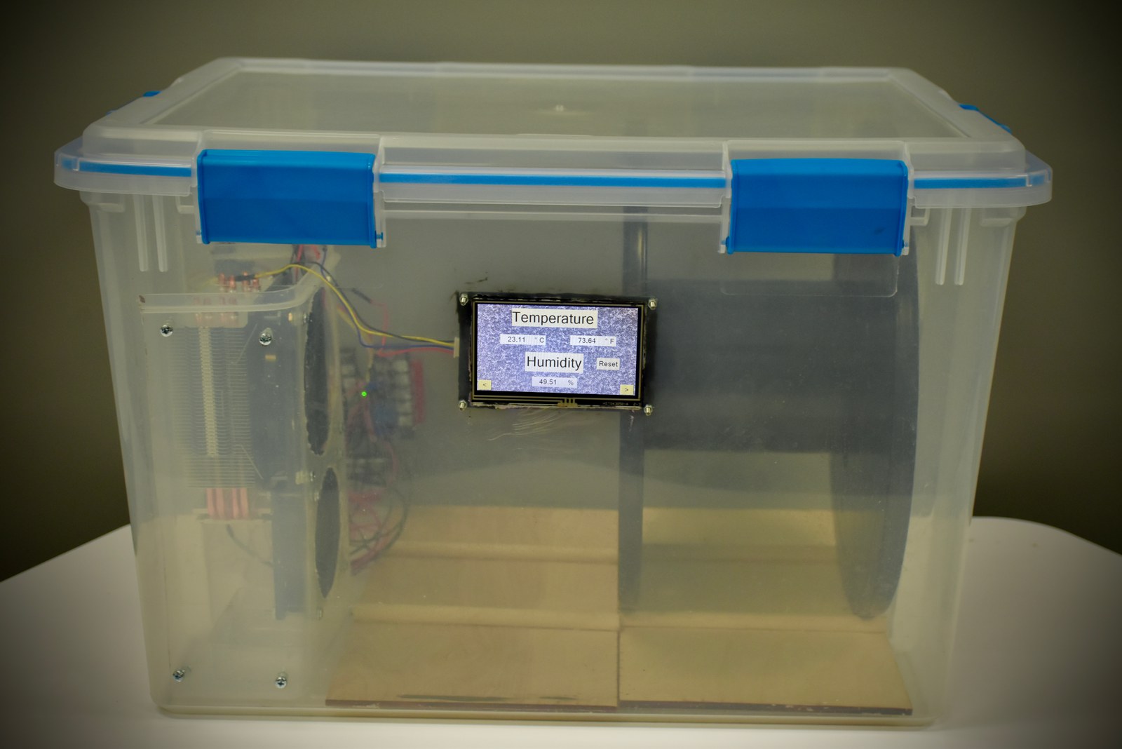 The re:store enclosure sealed, with live temperature and humidity readings on the touchscreen panel