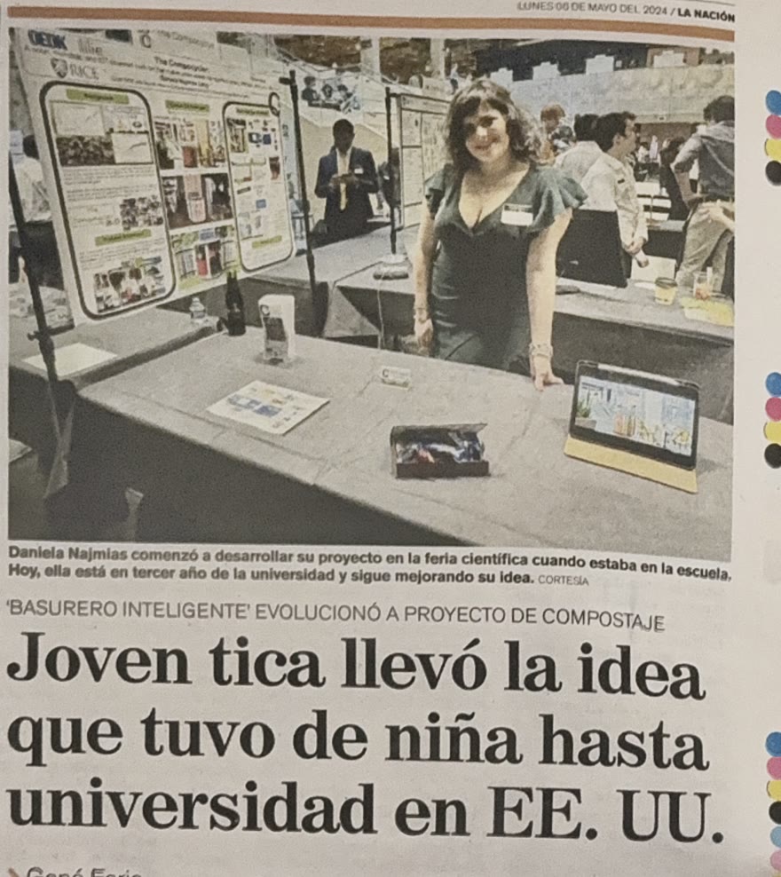 The printed La Naci&oacute;n page: Daniela beside her Compocycler poster at a Rice showcase, under the headline Joven tica llev&oacute; la idea que tuvo de ni&ntilde;a hasta universidad en EE. UU.